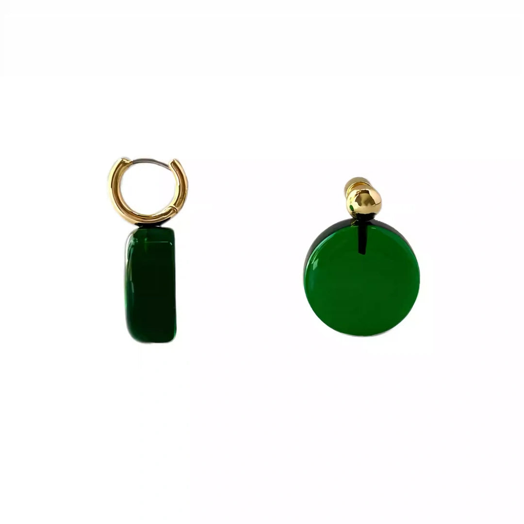 A pair of 2.5cm emerald green glass stud earrings featuring gold ball accents and hypoallergenic stainless steel pins.