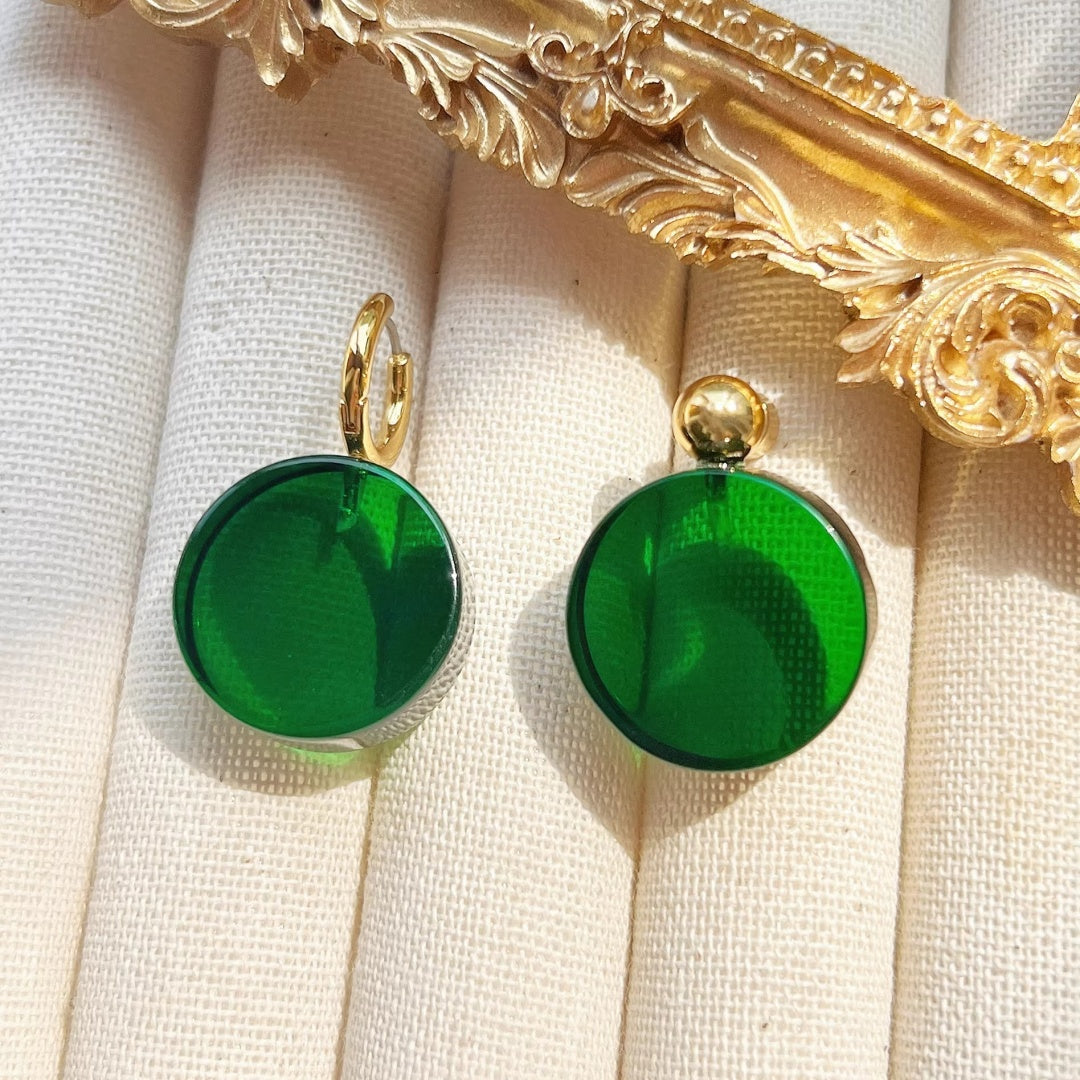 Two styles of emerald glass earrings: the 3cm hoop version and the 2.5cm gold ball stud version.