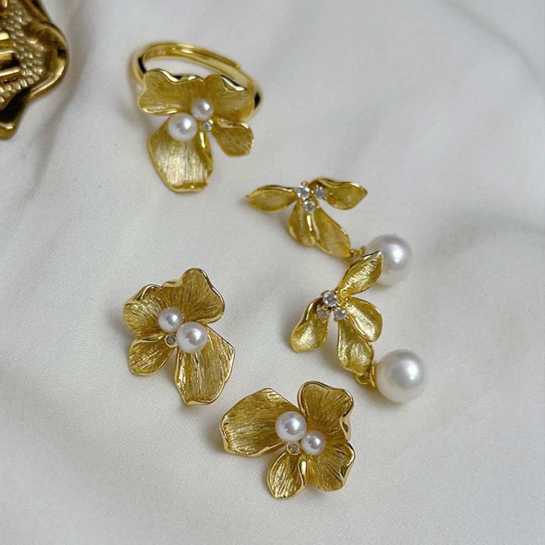 Close-up of Flower Statement Earrings featuring freshwater pearl statement earrings and three sparkling diamonds, perfect as bridal pearl statement earrings and Gold pearl earrings for a statement pearl earrings wedding look.