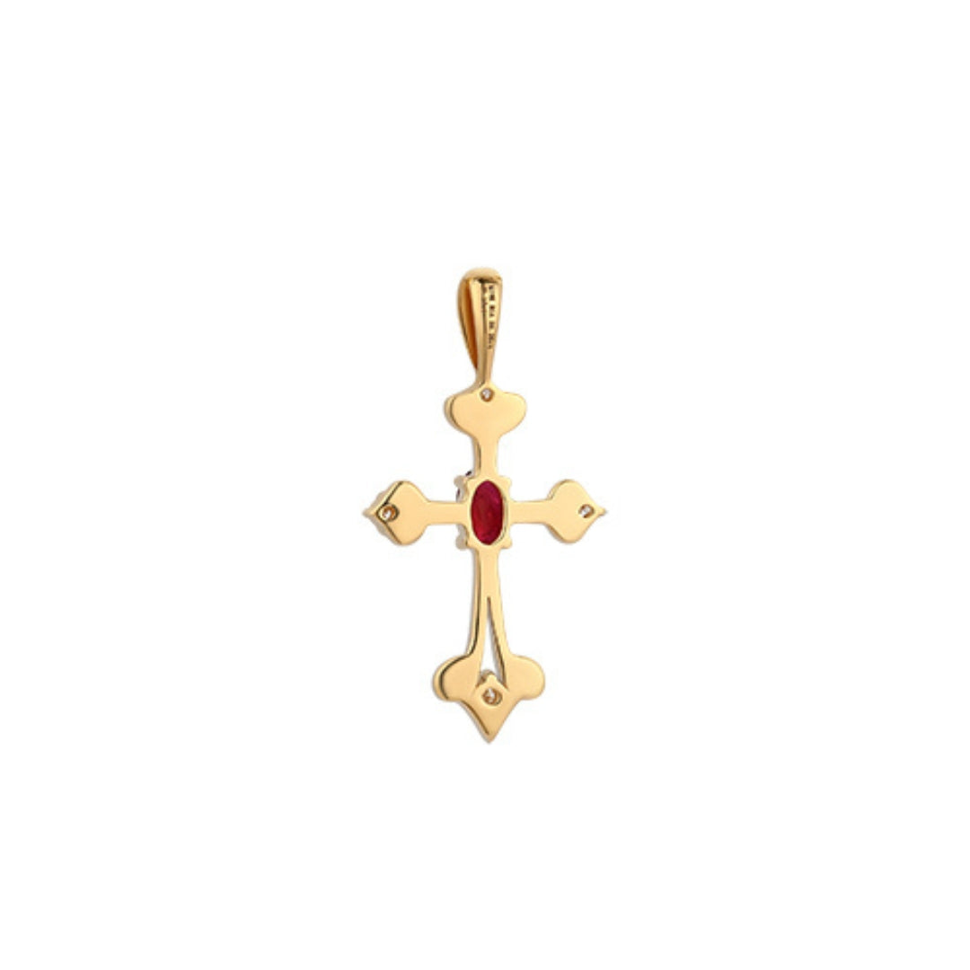 Polished Gold cross pendant with a ruby gemstone on a white background