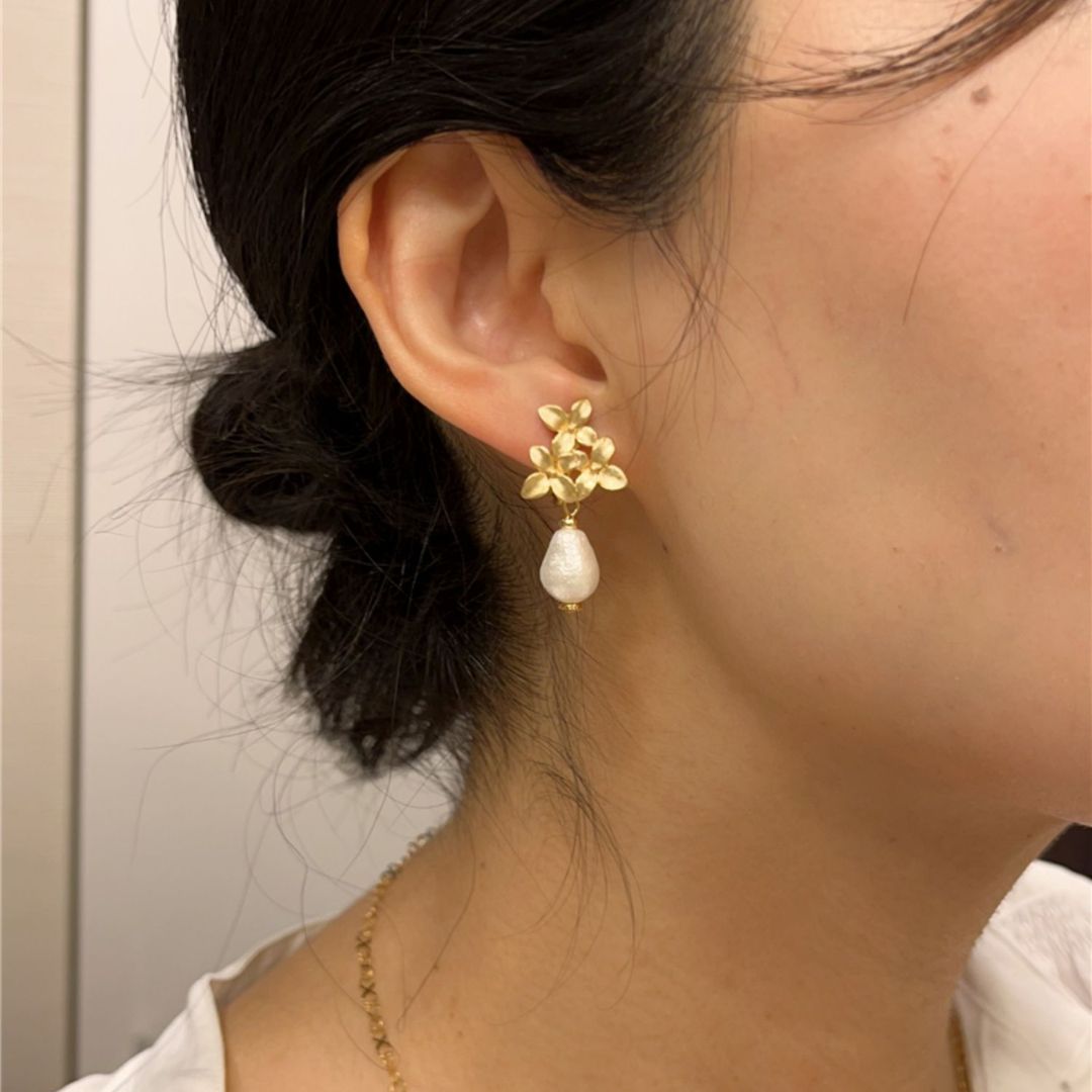 Pair of gold flower pearl earrings with teardrop pearls, ideal as wedding earrings or bridesmaid gift for a vintage-inspired look.