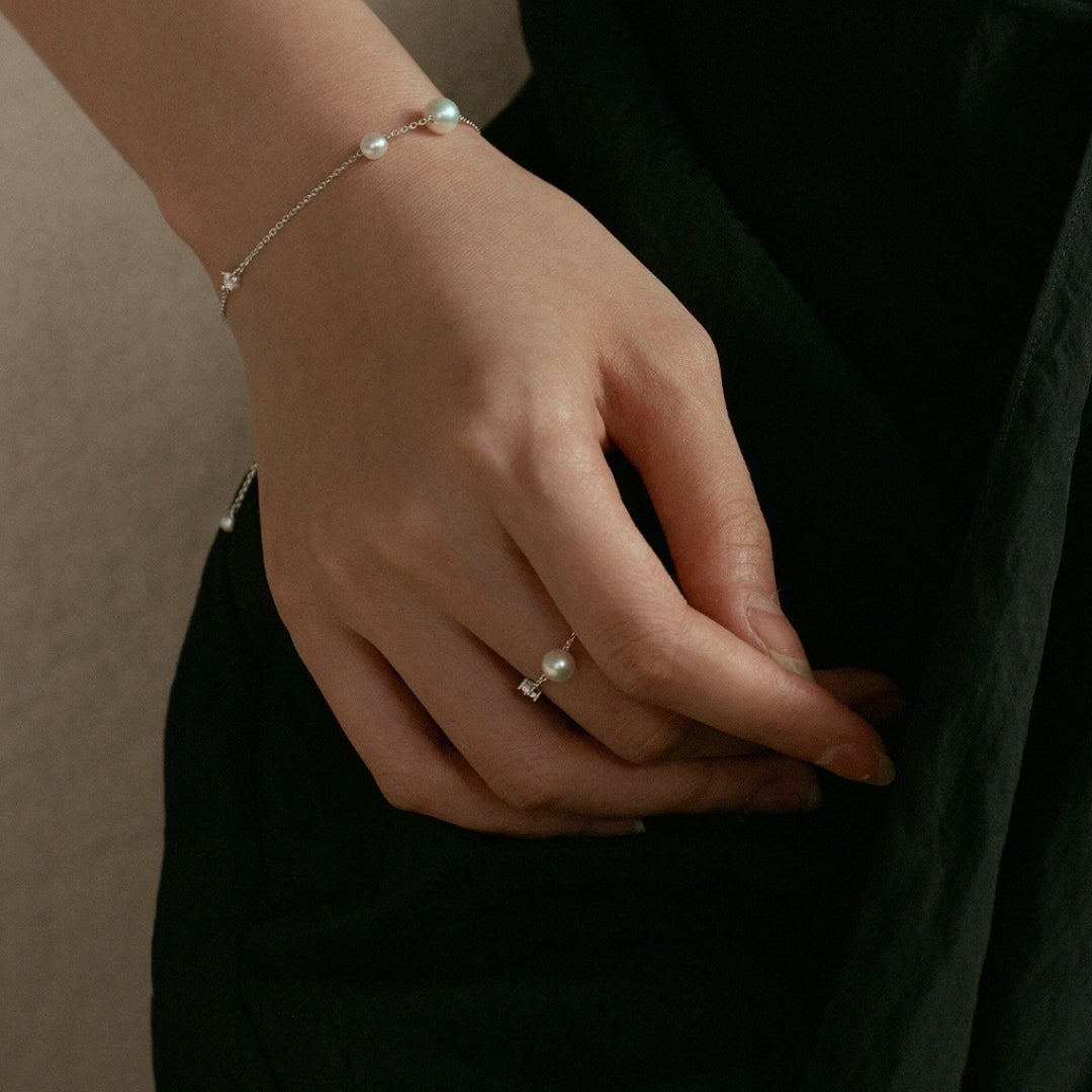 woman wearing 925 silver adjustable pearl ring with zircon accent by Lollimix