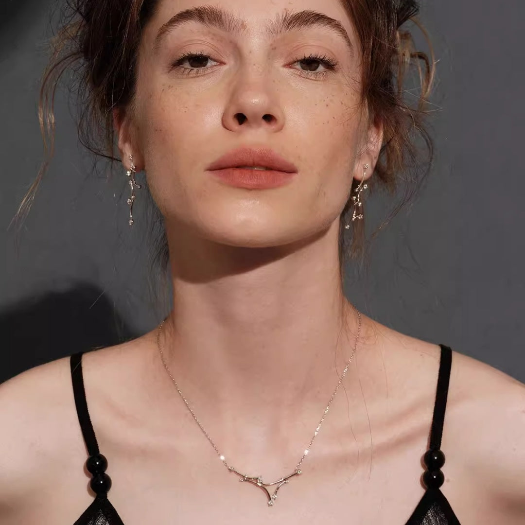 A model wearing the complete Celestial Vine bridal jewelry set including S925 sterling silver necklace, drop earrings, and vine bracelet for a wedding look. 1