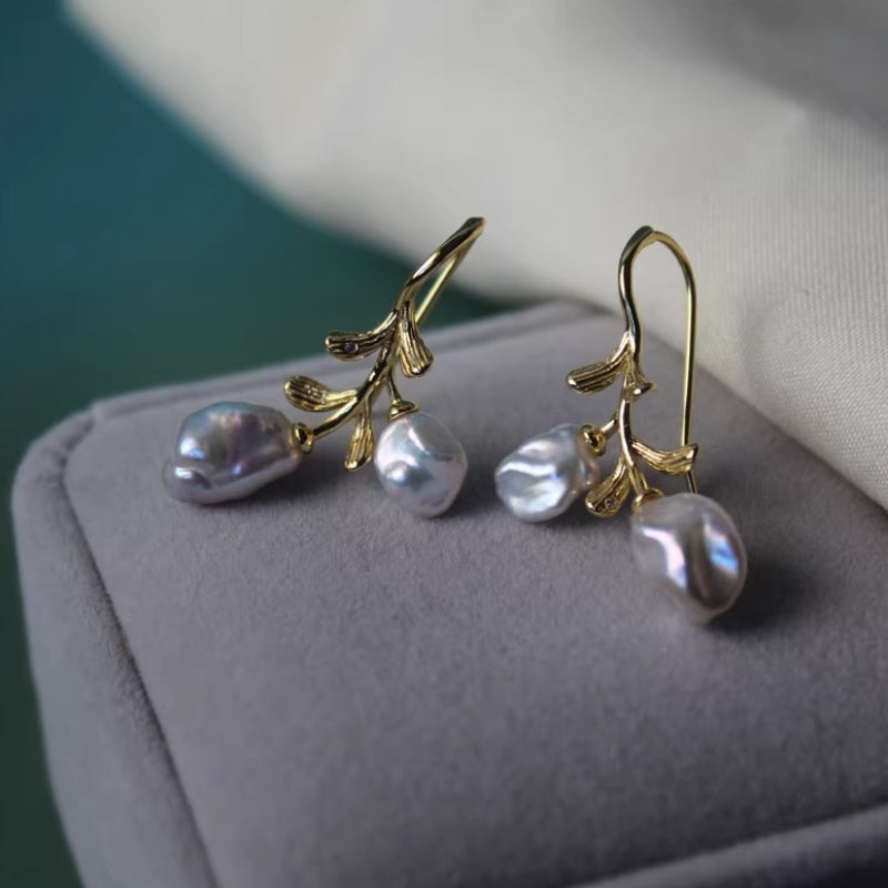 French vintage style pearl earrings inspired by forest vines and organic botanical forms.