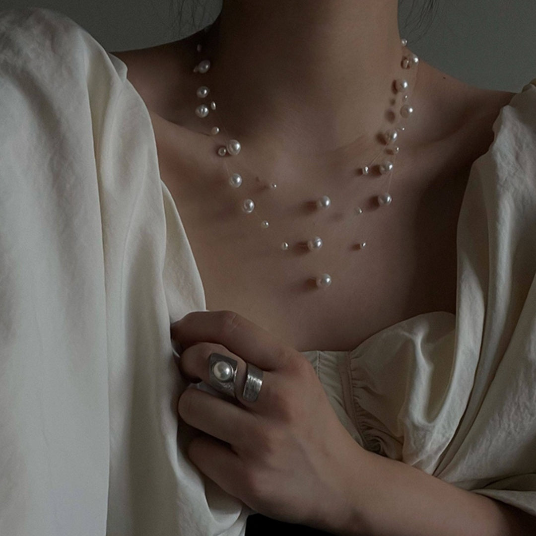 Illusion Floating Pearl elegant vintage natural freshwater pearl necklace enhancing neckline with a white romantic blouse - model-look-1