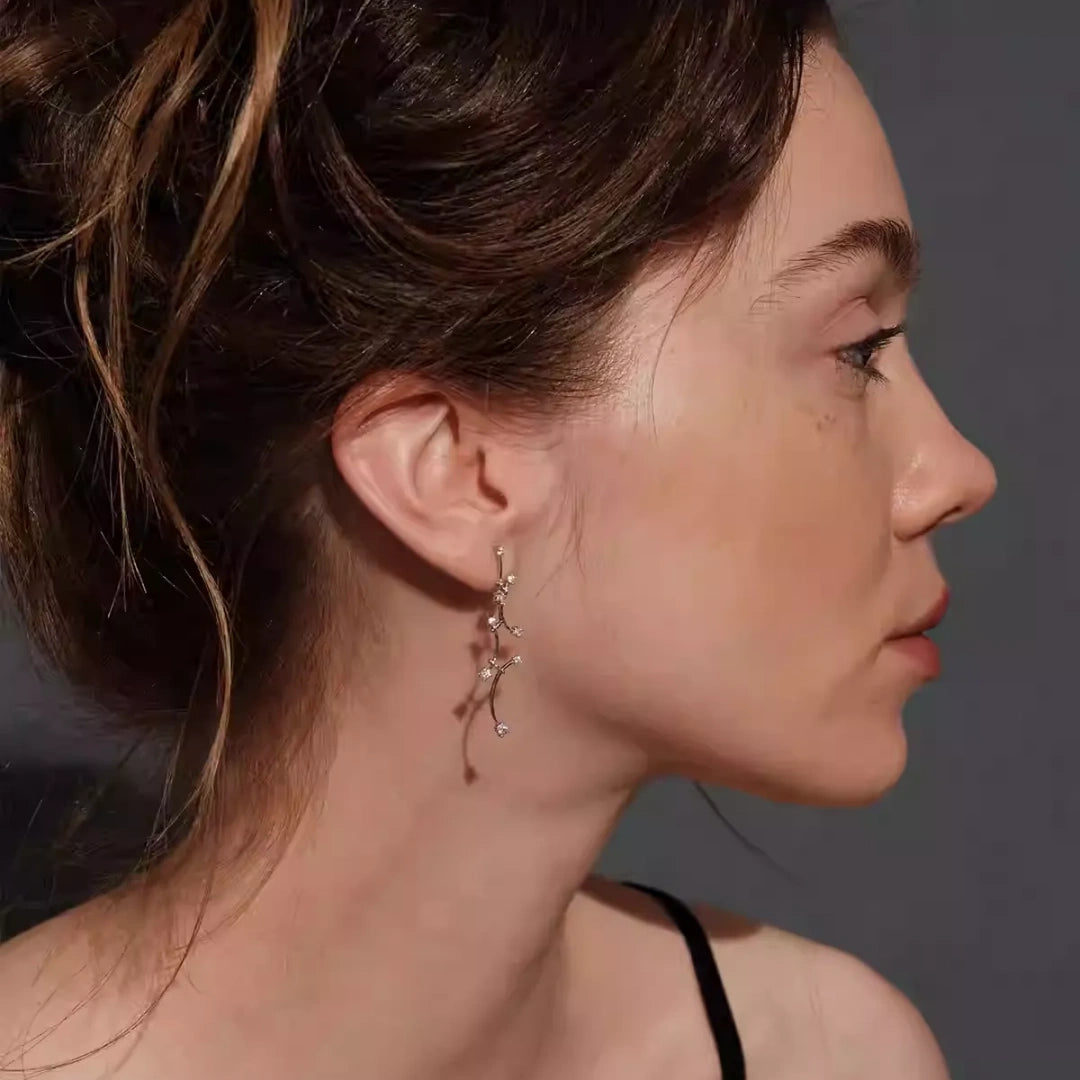 Elegant nature-inspired vine drop earrings in S925 silver featuring a swaying design to slim the face, ideal for brides. 3